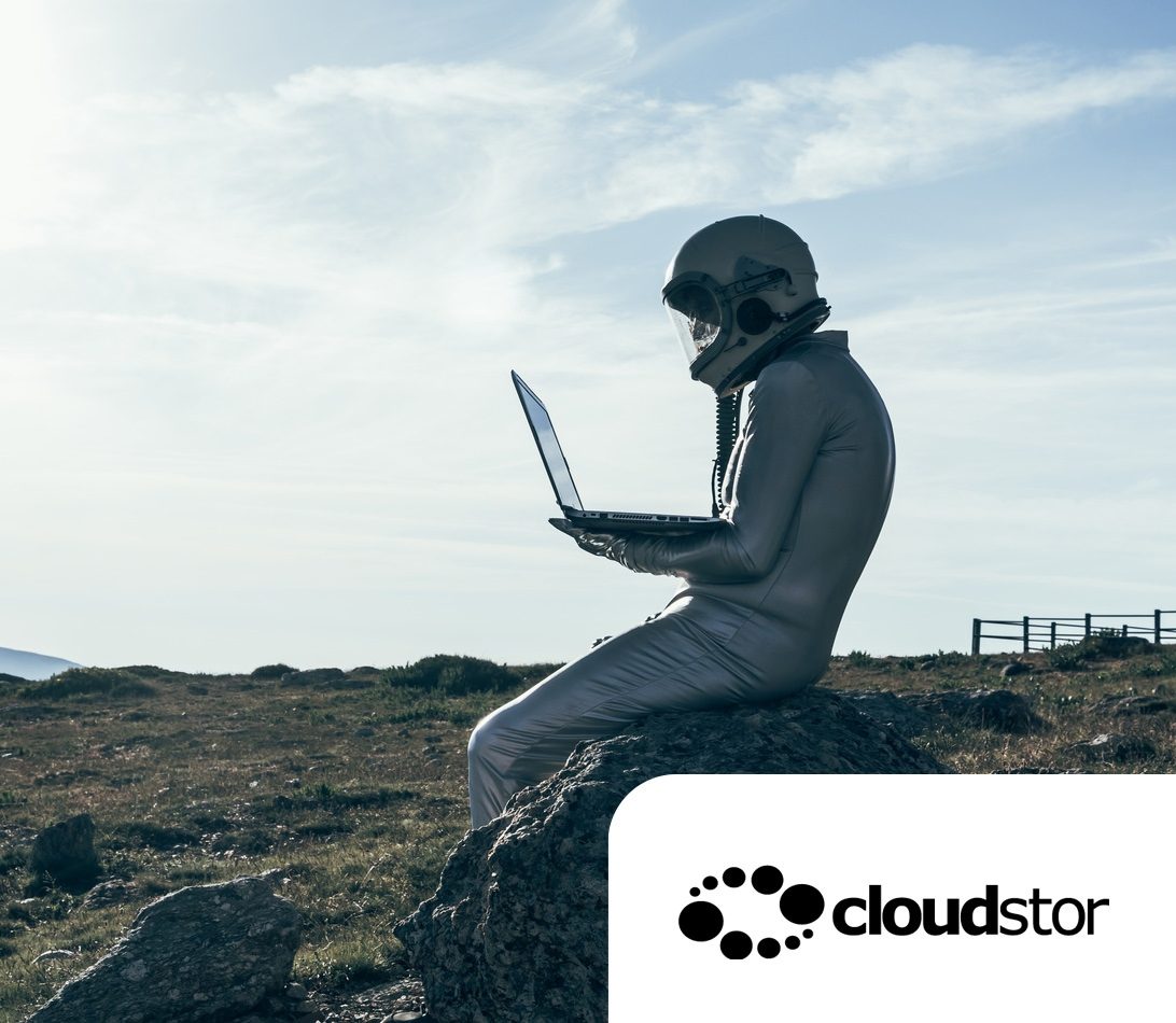 CloudStor cloud storage collaboration service astronaut sitting on laptop in field