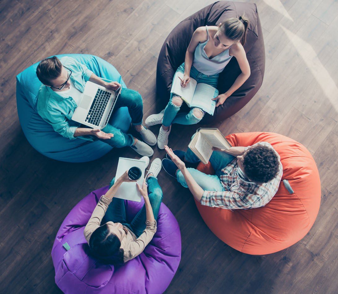 University students collaborating beanbags DDoS Protection service